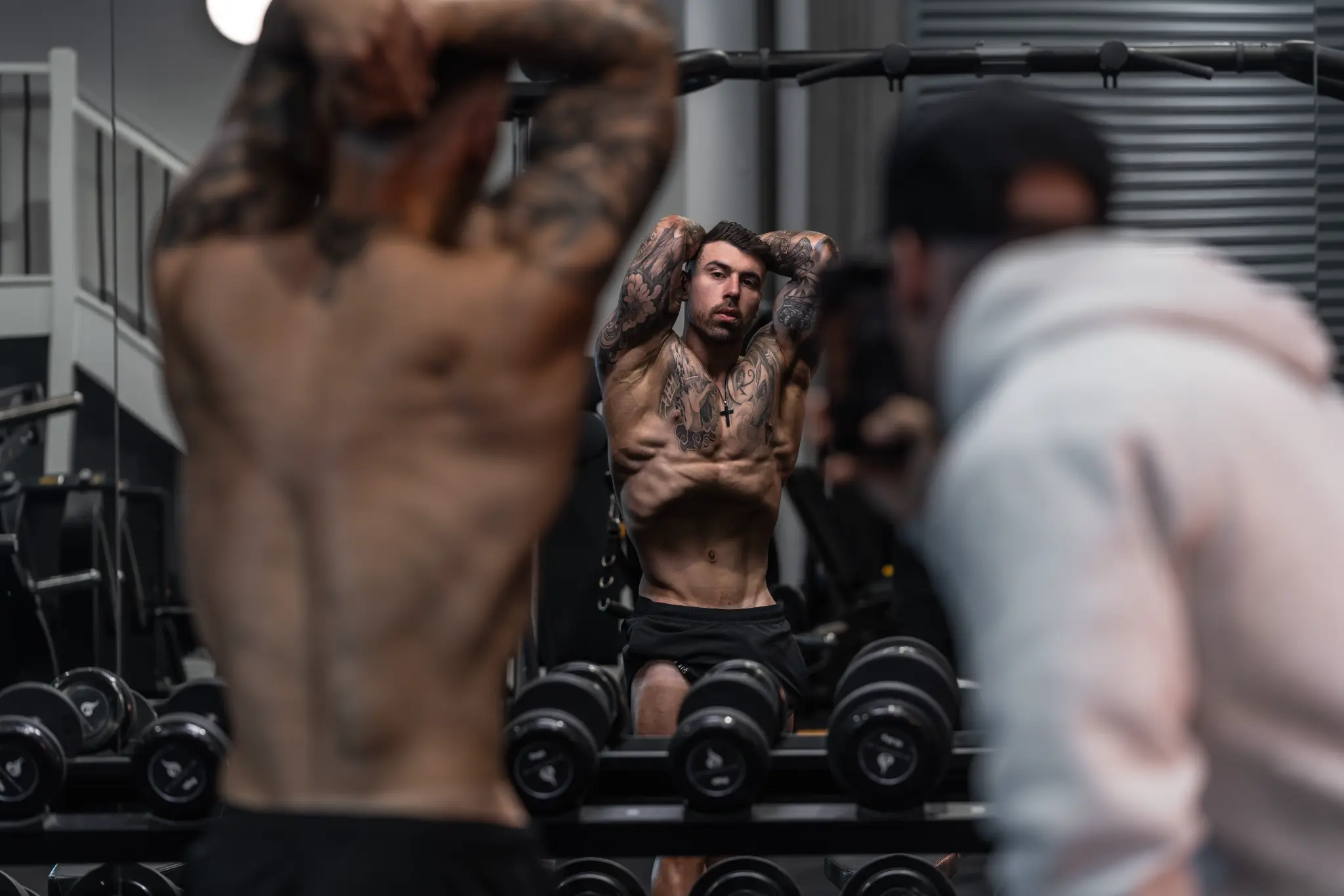 Ivan Tchorbadjiev coaching team training in a gym mirror